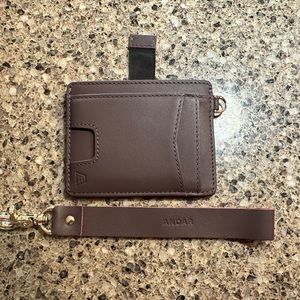 Gently used Andar Denner wallet in plum.